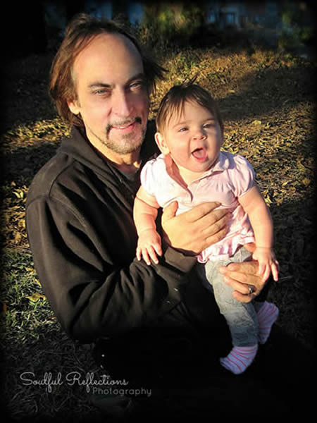 Artist Michael Vain of Reincarnations Painted Furnitrue and his daughter